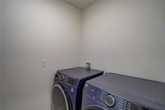 laundry area featuring washer hookup and washing machine and clothes dryer