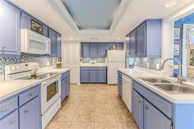 kitchen featuring blue cabinetry, light tile patterned flooring, white appliances, and sink