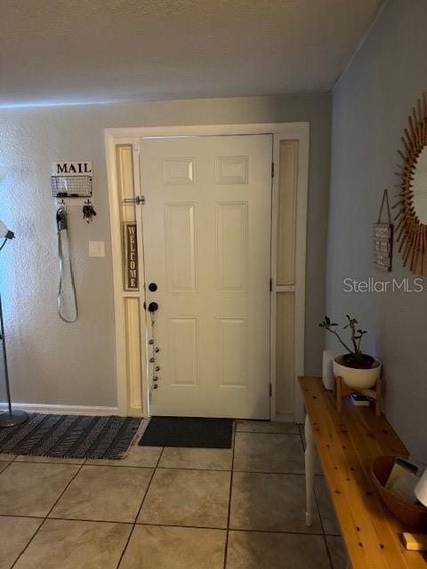 foyer featuring tile floors