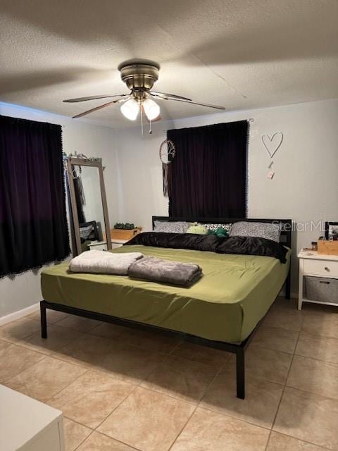 bedroom featuring tile flooring and ceiling fan