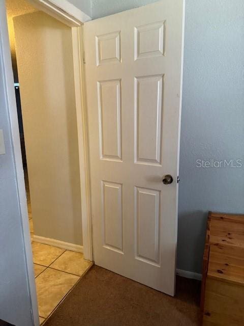 hallway featuring tile flooring