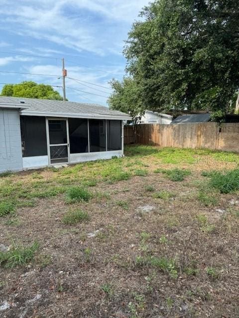 view of yard featuring a sunroom