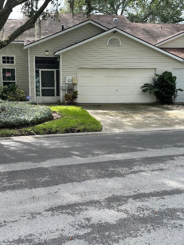 view of side of home featuring a garage