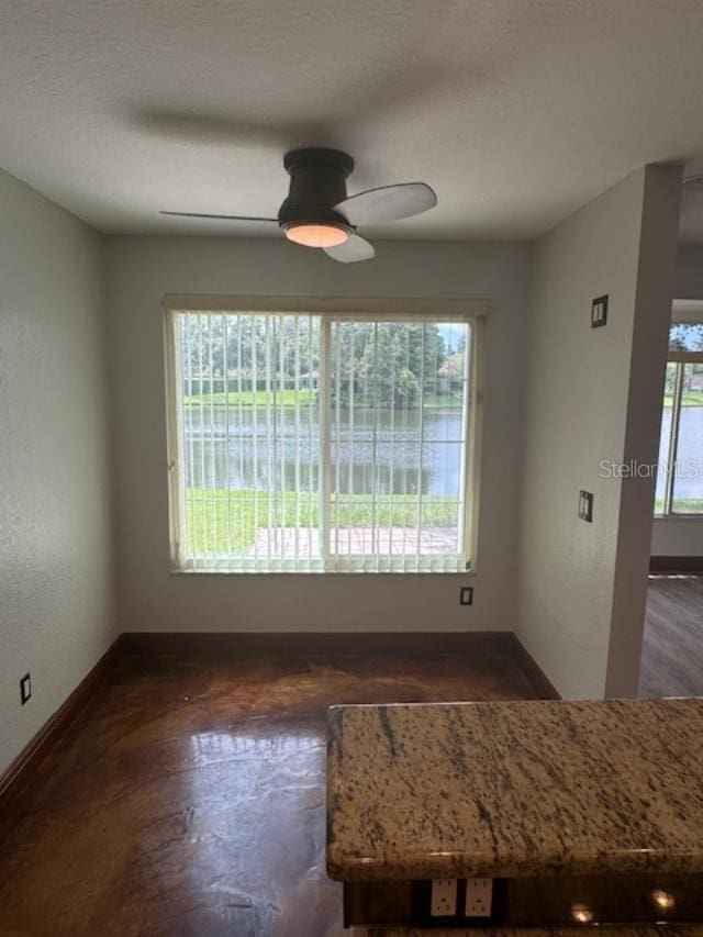 unfurnished dining area with a healthy amount of sunlight and ceiling fan