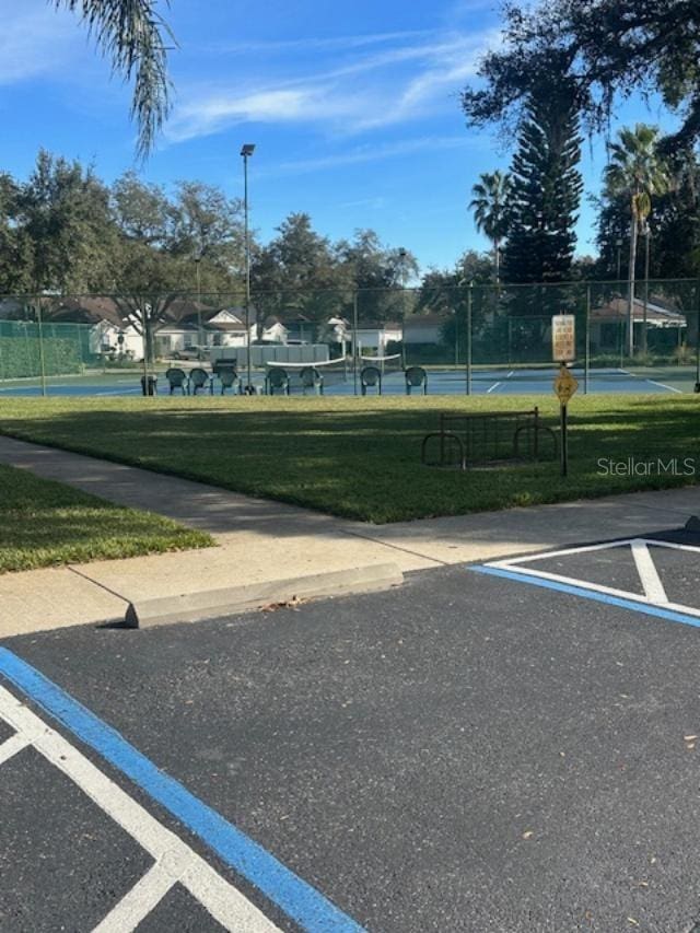 view of vehicle parking featuring a yard