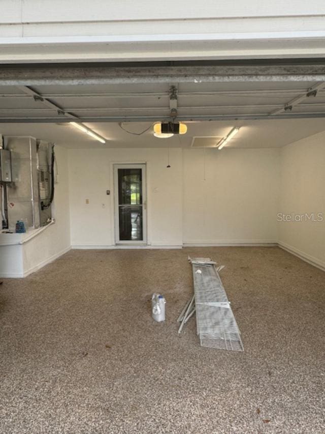 garage featuring a garage door opener