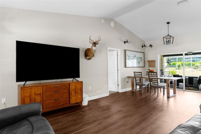 living room with high vaulted ceiling and dark wood-type flooring