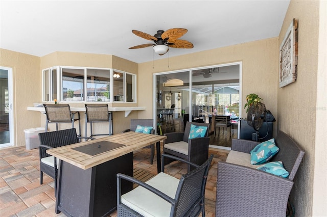 view of patio / terrace with ceiling fan and outdoor lounge area