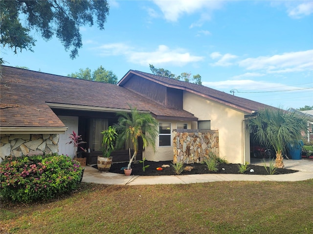 ranch-style home featuring a front yard