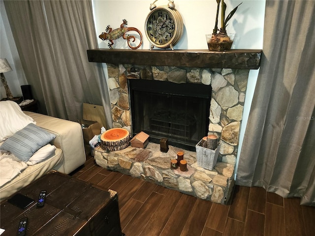 living room featuring dark hardwood / wood-style floors and a fireplace