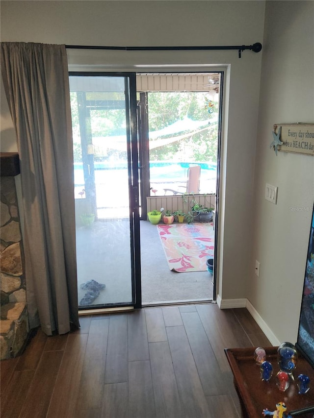 doorway to outside featuring hardwood / wood-style flooring