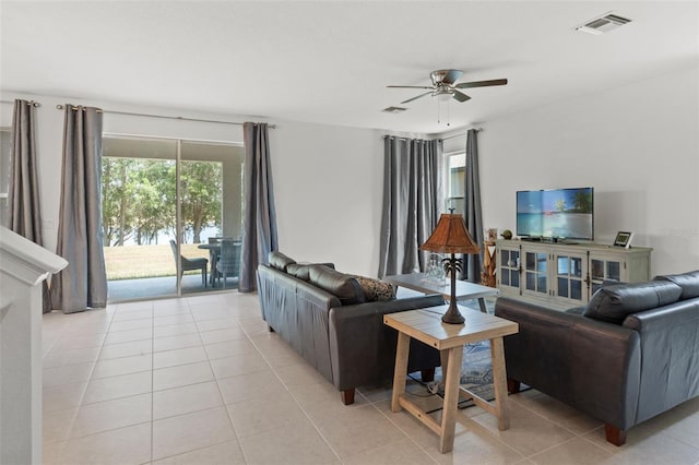 tiled living room featuring ceiling fan