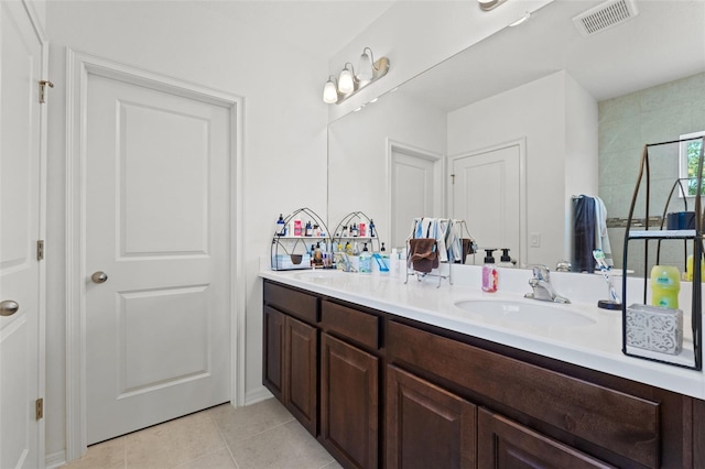 bathroom with tile floors and double vanity