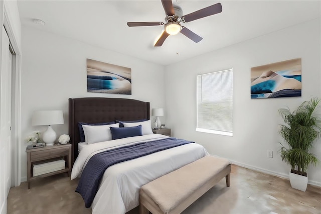 bedroom featuring concrete floors, a closet, and ceiling fan