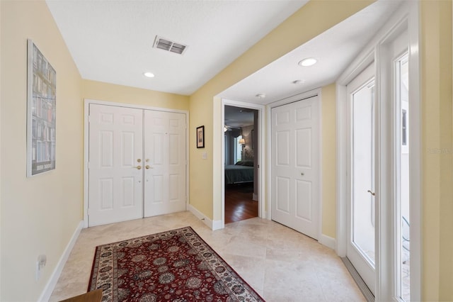 entrance foyer featuring light tile patterned floors