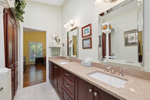 bathroom with vanity and wood-type flooring