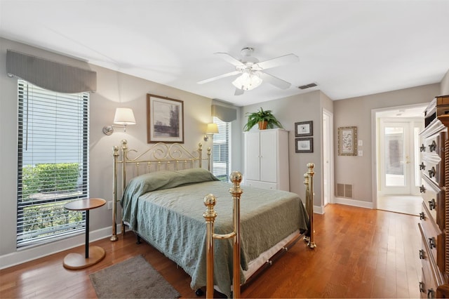 bedroom with ceiling fan and wood-type flooring