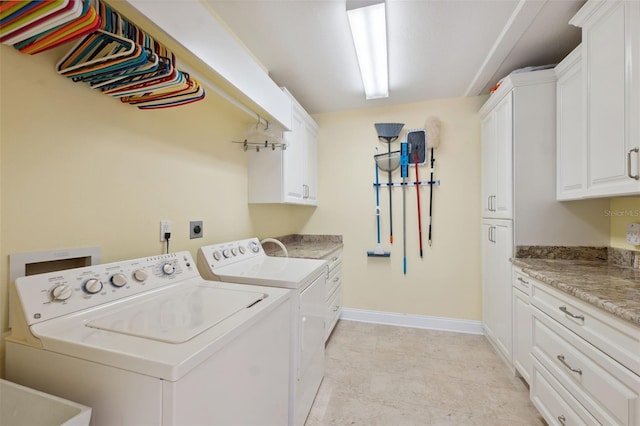 laundry room with sink, cabinets, and independent washer and dryer