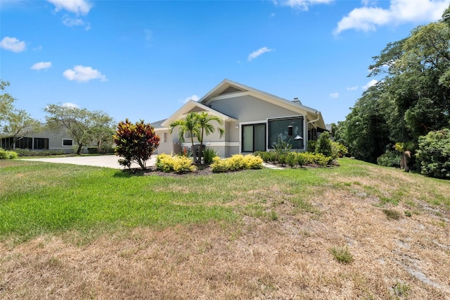 view of home's exterior featuring a yard