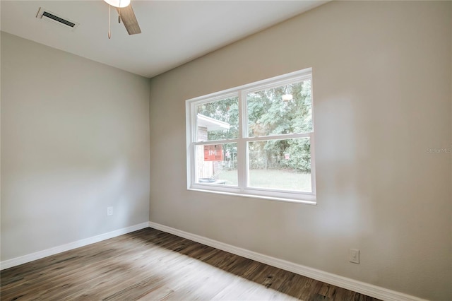 empty room featuring ceiling fan and hardwood / wood-style flooring