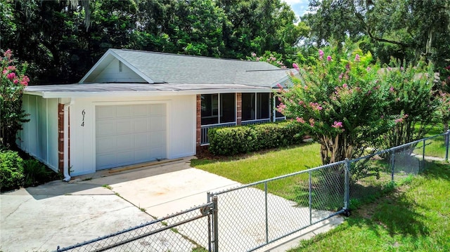 ranch-style home with driveway, a shingled roof, fence private yard, a front yard, and a garage