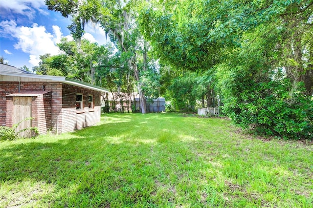 view of yard with fence