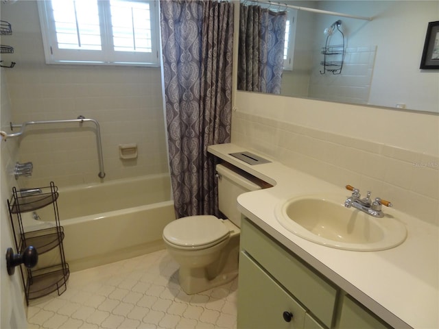 full bathroom featuring backsplash, tile patterned floors, toilet, shower / bath combo with shower curtain, and vanity