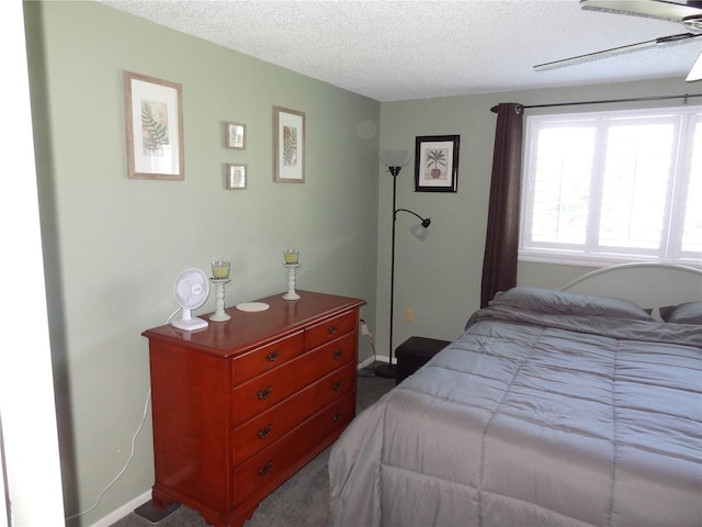 bedroom featuring a textured ceiling and ceiling fan