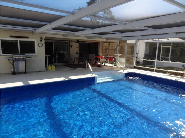 view of pool with a patio, grilling area, and a lanai