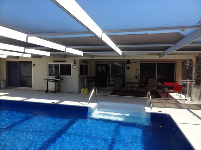 view of pool featuring a patio, grilling area, and a lanai