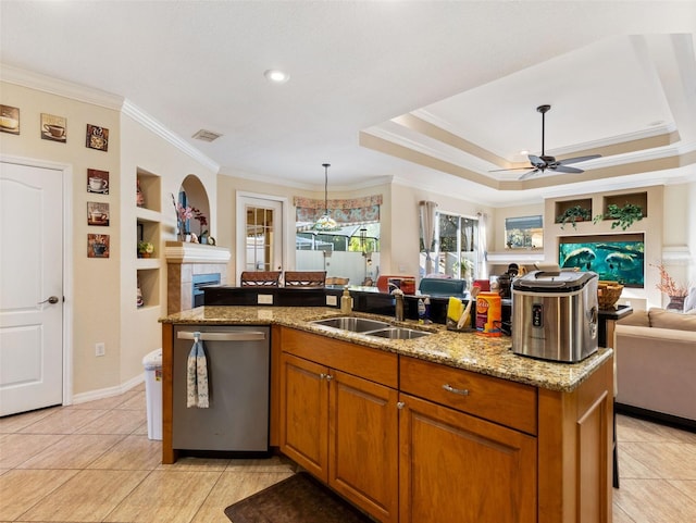 kitchen featuring light stone countertops, built in shelves, ceiling fan, sink, and dishwasher