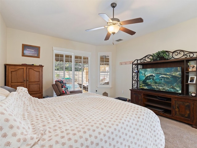 carpeted bedroom featuring ceiling fan