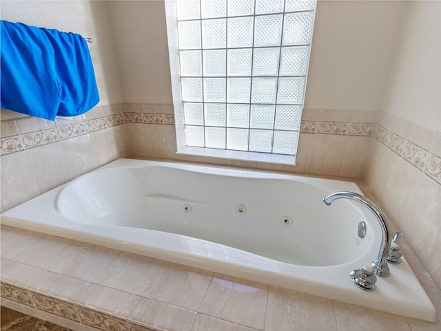 bathroom with a relaxing tiled tub