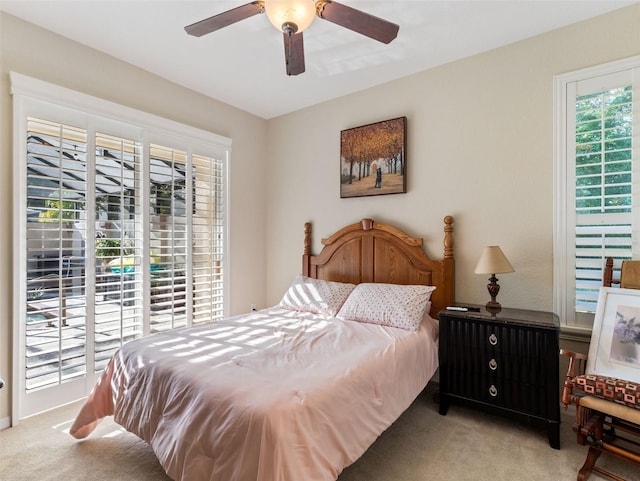 carpeted bedroom featuring ceiling fan