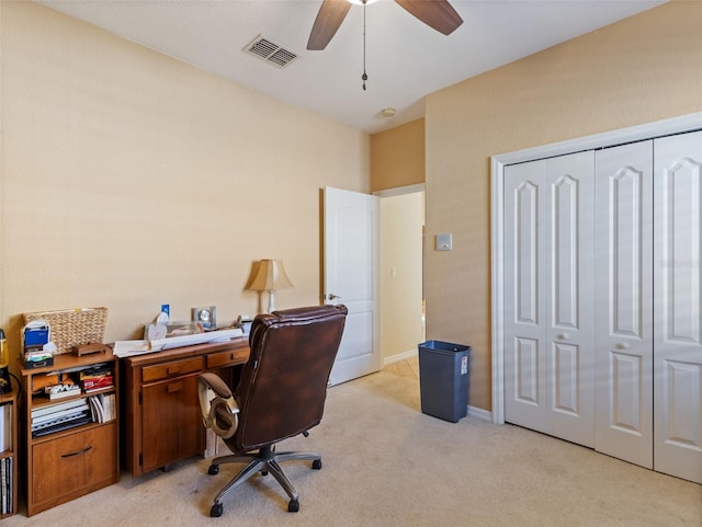 carpeted office featuring ceiling fan