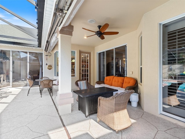 view of patio featuring ceiling fan