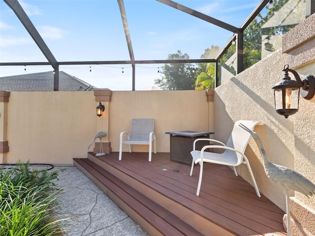 wooden deck with a lanai