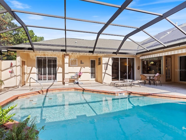 view of pool with a lanai and a patio