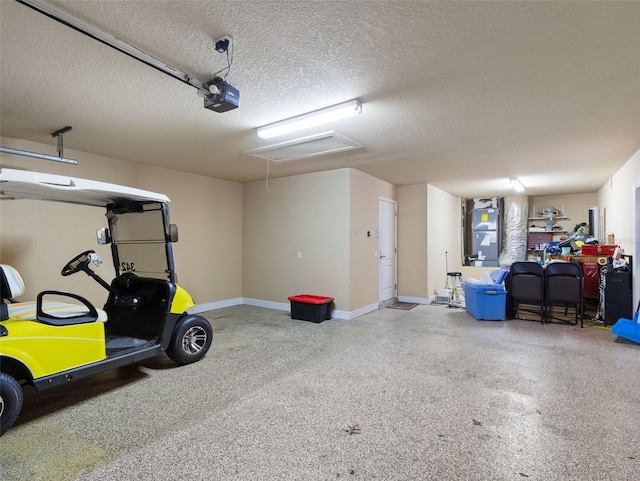 garage with a garage door opener and heating unit