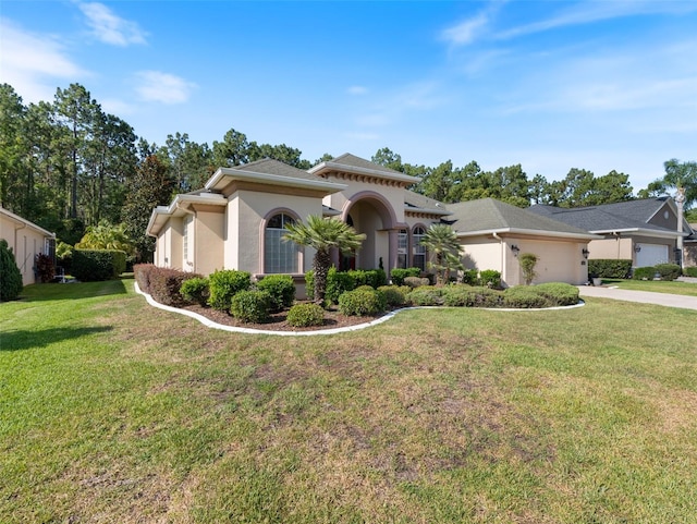 view of front of house featuring a front lawn and a garage