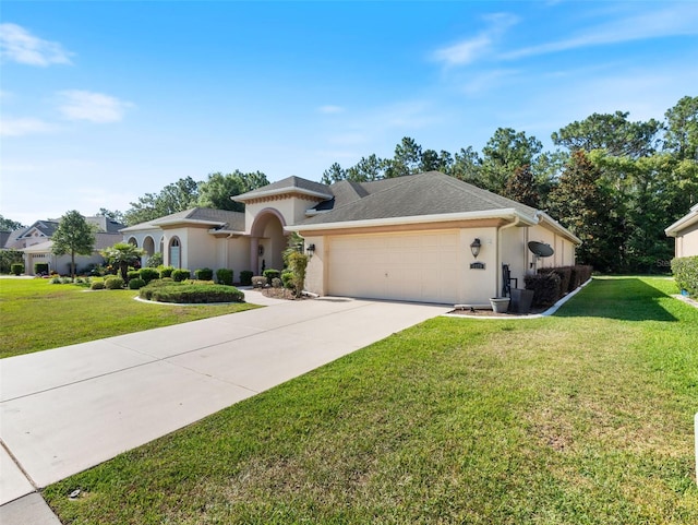 view of front of home with a front yard and a garage