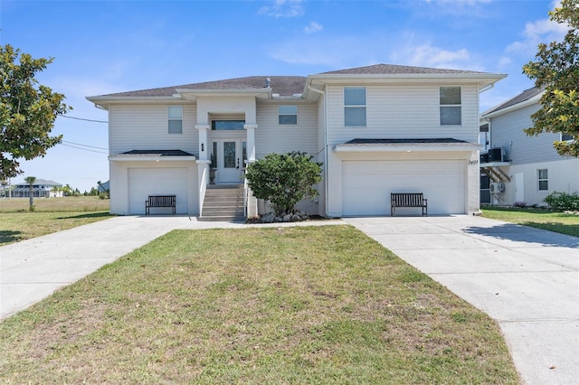 view of front of house featuring a garage and a front yard