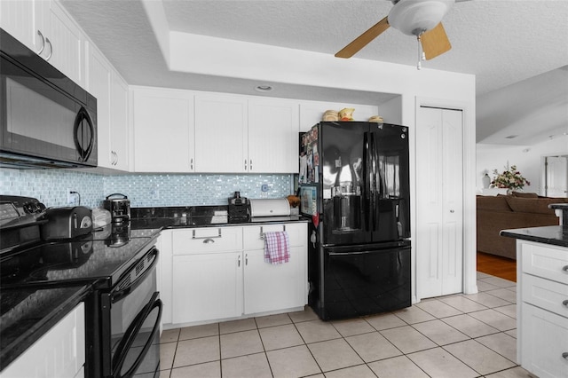 kitchen with tasteful backsplash, light tile patterned flooring, white cabinets, and black appliances