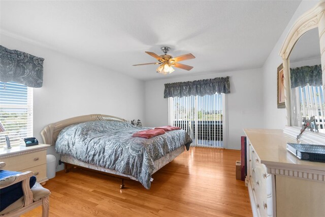 bedroom featuring ceiling fan, light wood-type flooring, and access to outside