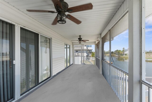 unfurnished sunroom with a water view