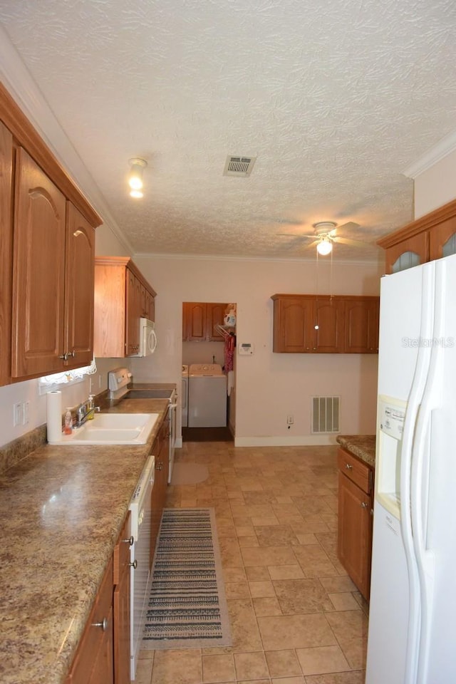 kitchen with ornamental molding, a textured ceiling, white appliances, ceiling fan, and sink