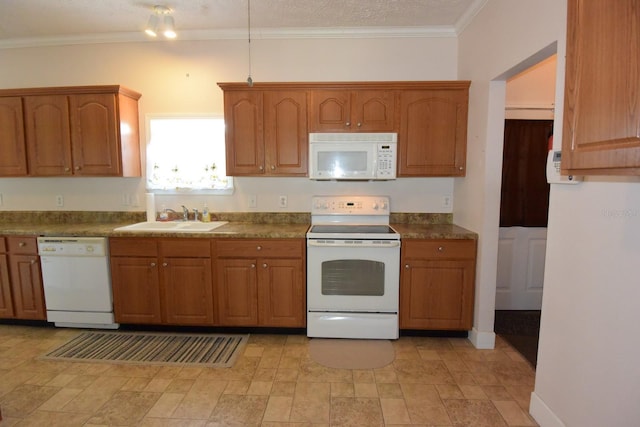 kitchen with a textured ceiling, crown molding, sink, and white appliances