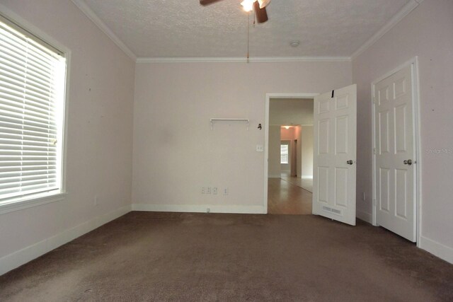 unfurnished room with ornamental molding, ceiling fan, and a healthy amount of sunlight