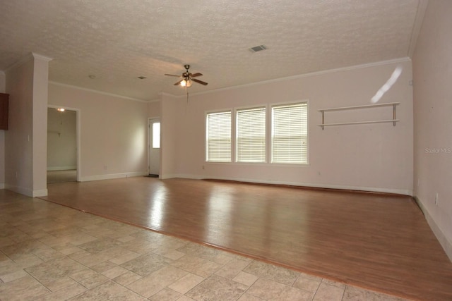 spare room with a textured ceiling, light hardwood / wood-style floors, ceiling fan, and ornamental molding