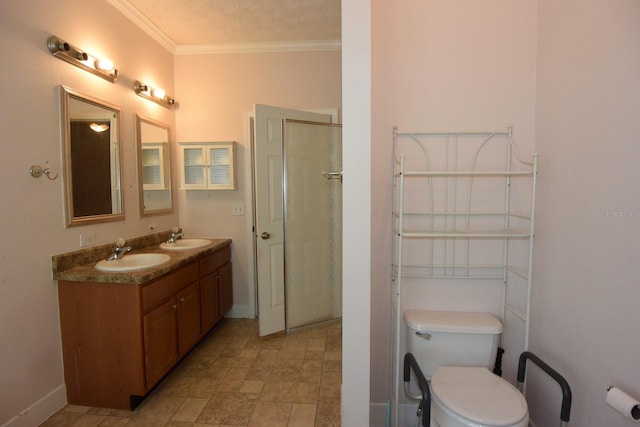 bathroom with vanity, a textured ceiling, crown molding, toilet, and a shower with shower door